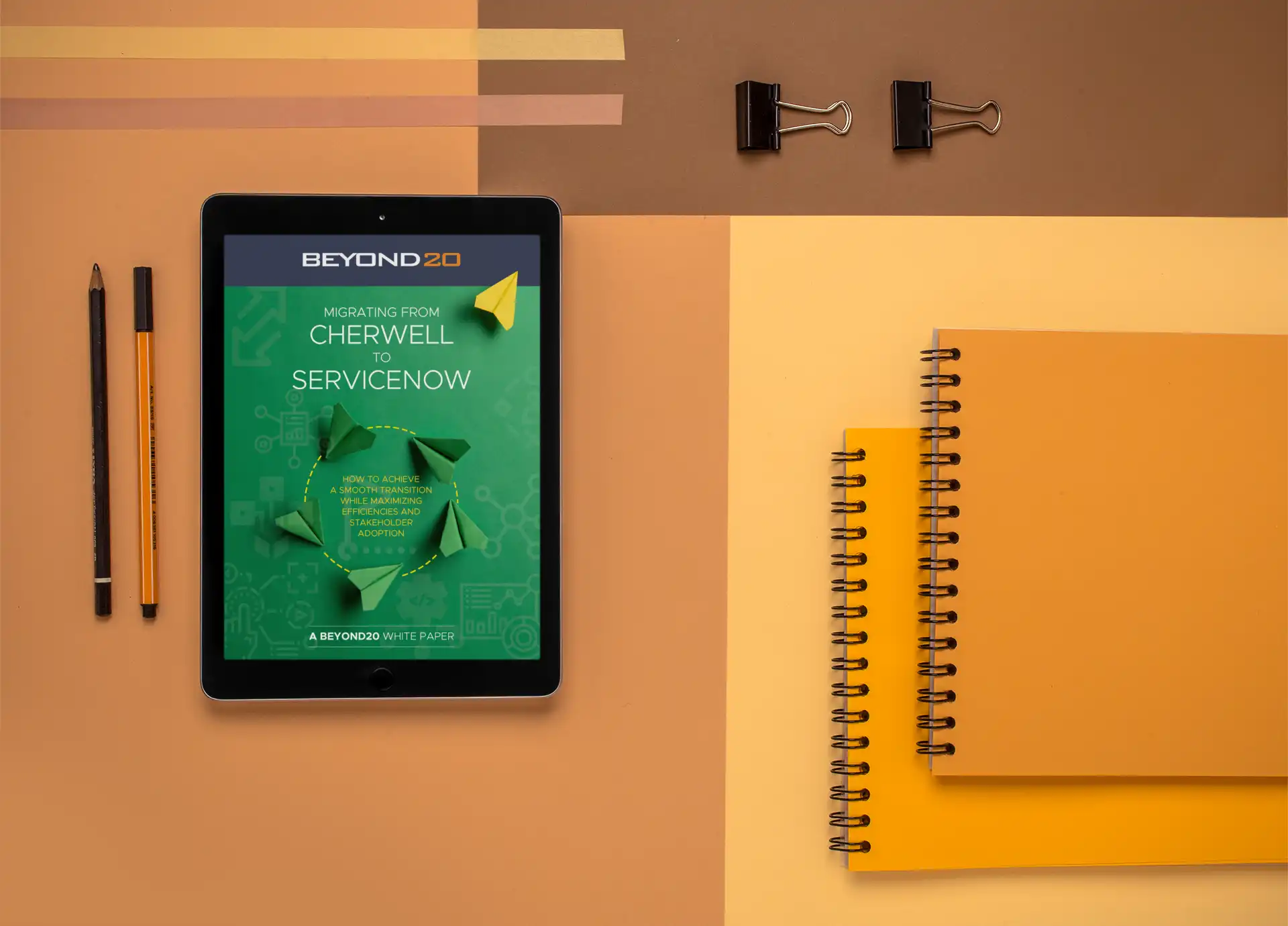 organized desk with ipad showing cover page of white paper